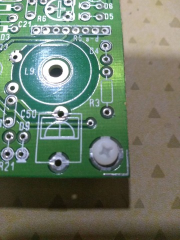 the unpopulated via on the bottom right